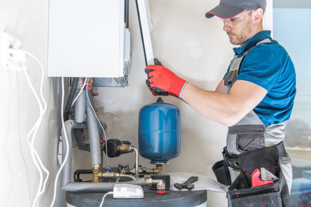 A man working on an air compressor.